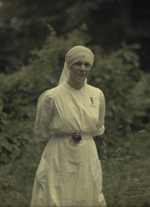 A pretty Red Cross nurse poses for the camera