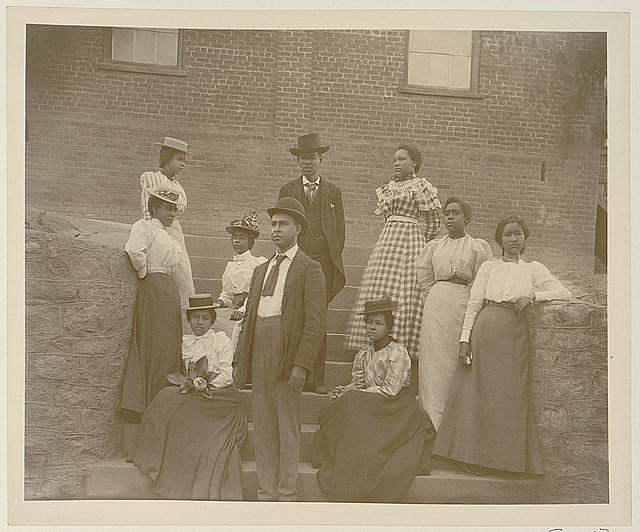 Group, dressed to the 9s, poses on steps, circa 1900 loc-govloc-pnpppmsca-08764